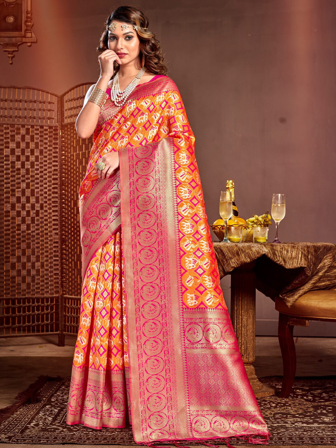 

Mitera Orange & Gold-Toned Ethnic Motifs Printed Zari Pure Silk Patola Saree