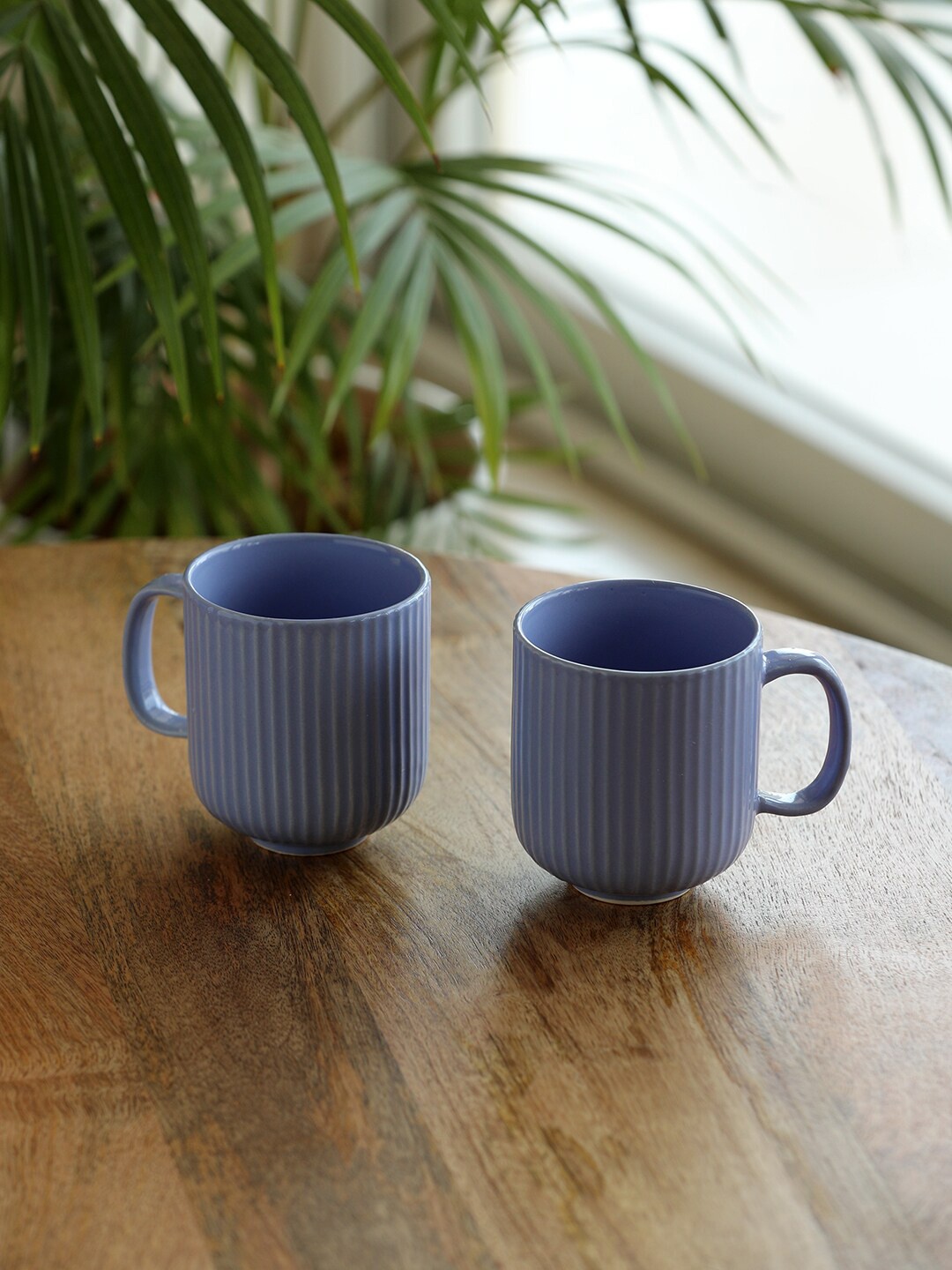 

ExclusiveLane 2 Pcs Blue Textured Ceramic Glossy Coffee Mugs - 300 ML