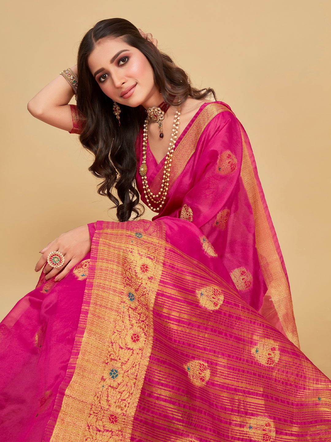 

Sangria Pink Ethnic Motifs Woven Design Zari Organza Saree