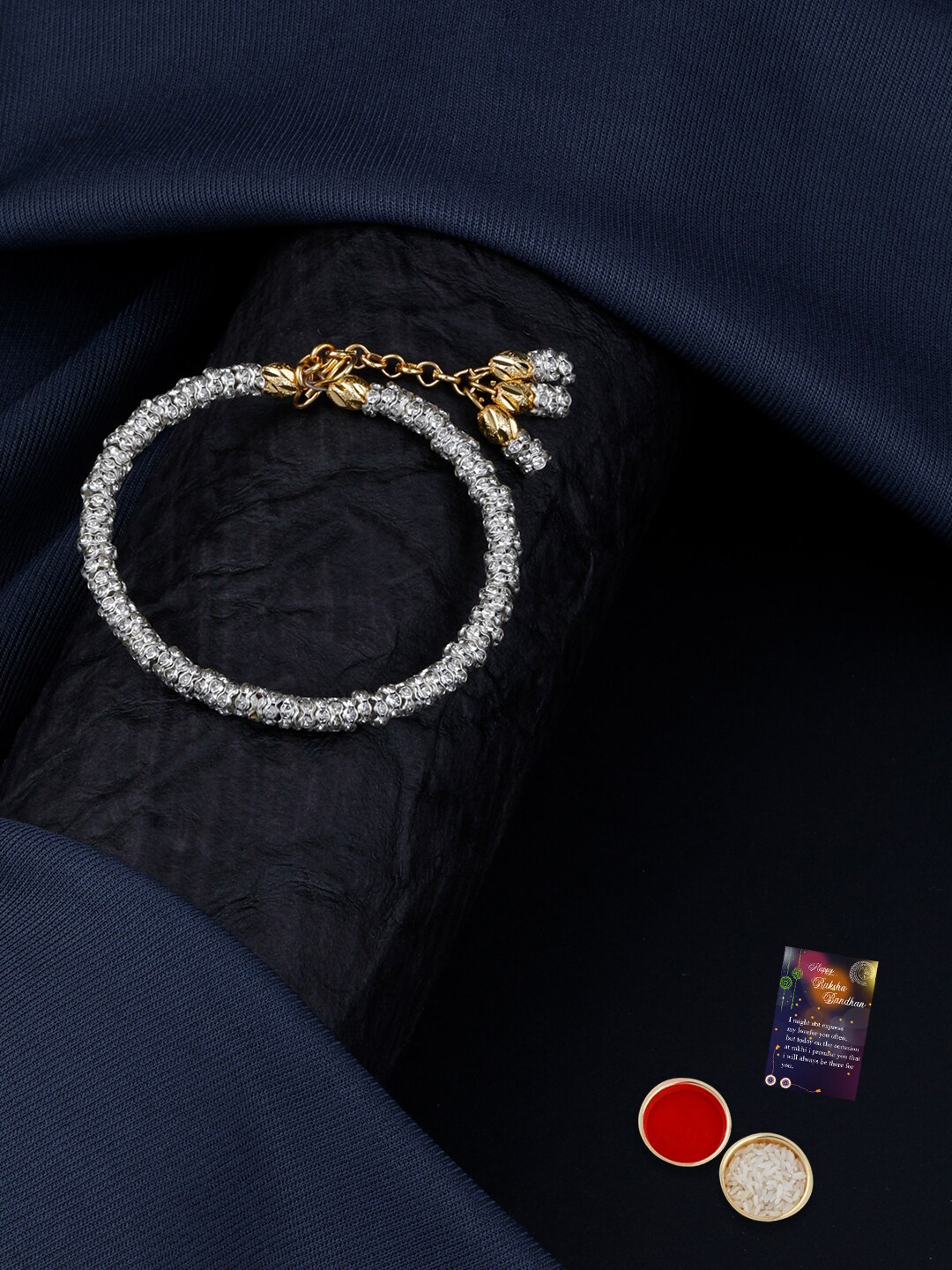 

Silver Shine Set Of 2 Gold-Plated Rakhi & kada, With Roli Chawal And Greeting Card