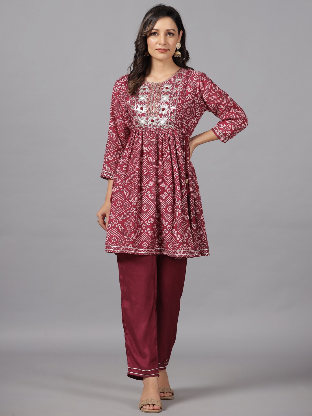 

Amchoor Ethnic Motifs Printed Round Neck Thread Work A-Line Kurti With Trousers, Maroon