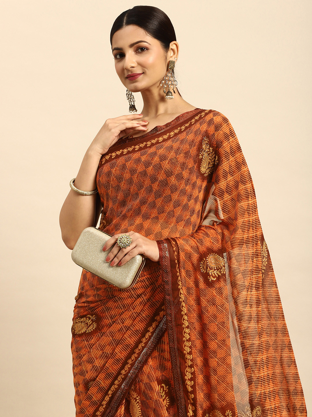 

Mitera Ethnic Motifs Stones-Studded Pure Georgette Saree, Orange
