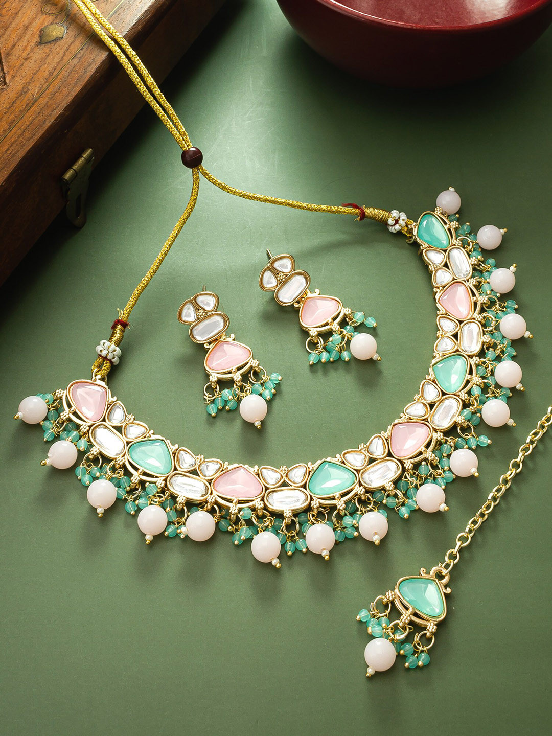 

aadita Gold-Plated Stone-Studded & Beaded Jewellery Set