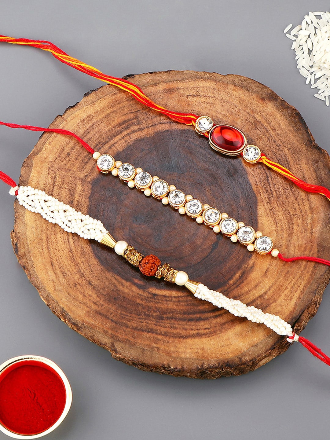 

AccessHer Set Of 3 Stone-Studded & Beaded Rakhi With Roli Rice & Greeting Card, Red