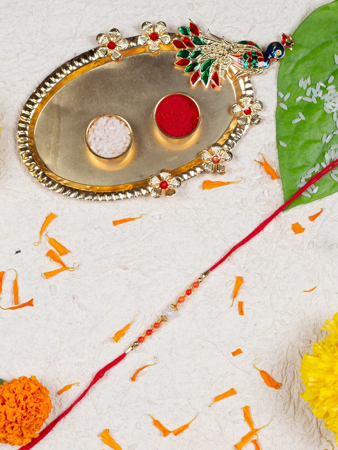 

AccessHer Pearl Beaded Rakhi With Roli, Rice, Greeting Card & Pooja Thali, Red