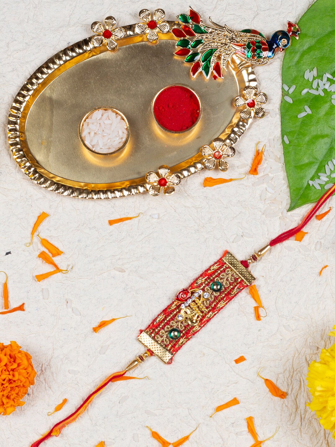 

AccessHer Thread Rakhis With Roli, Rice, Greeting Card & Pooja Thali, Gold