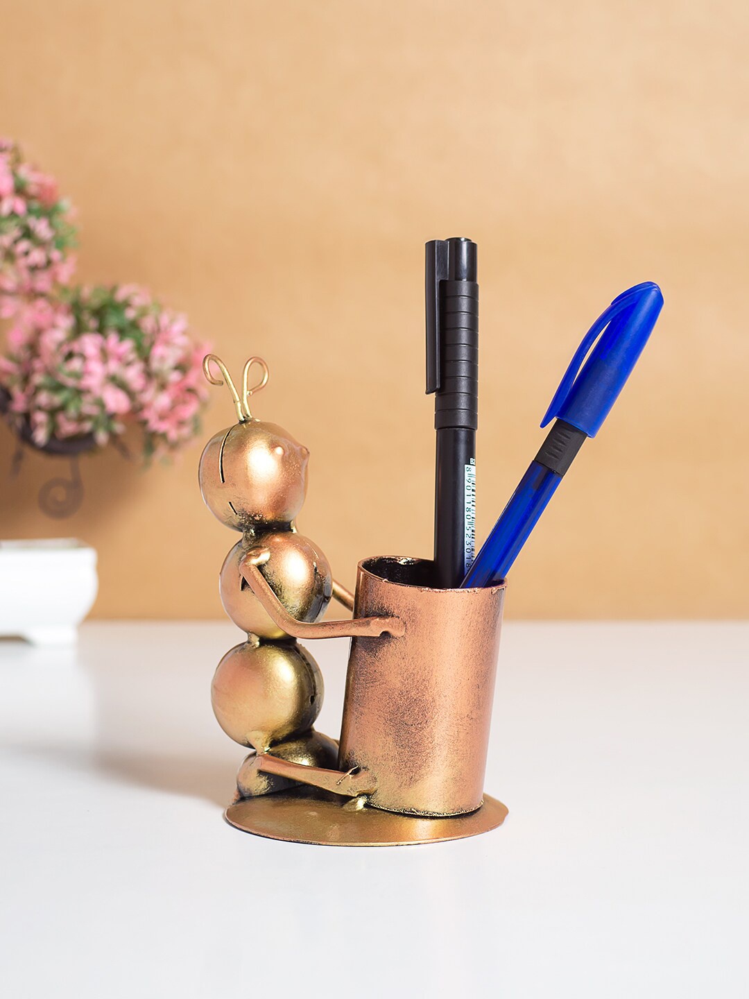 

Golden Peacock Beige Caterpillar Pen Stand Showpieces, Copper