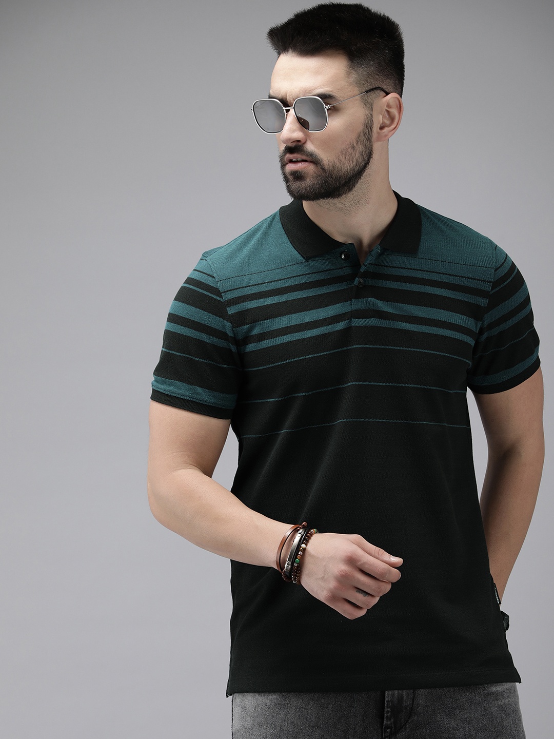

Roadster Men Striped Polo Collar T-shirt, Teal