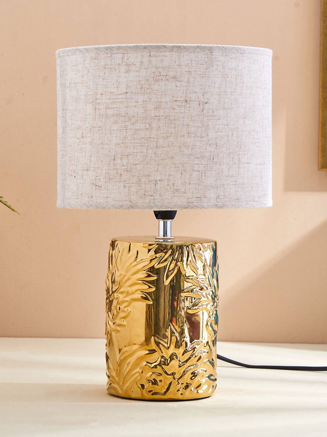 

Home Centre Tranquil Off White & Golden Textured Ceramic Table Lamp