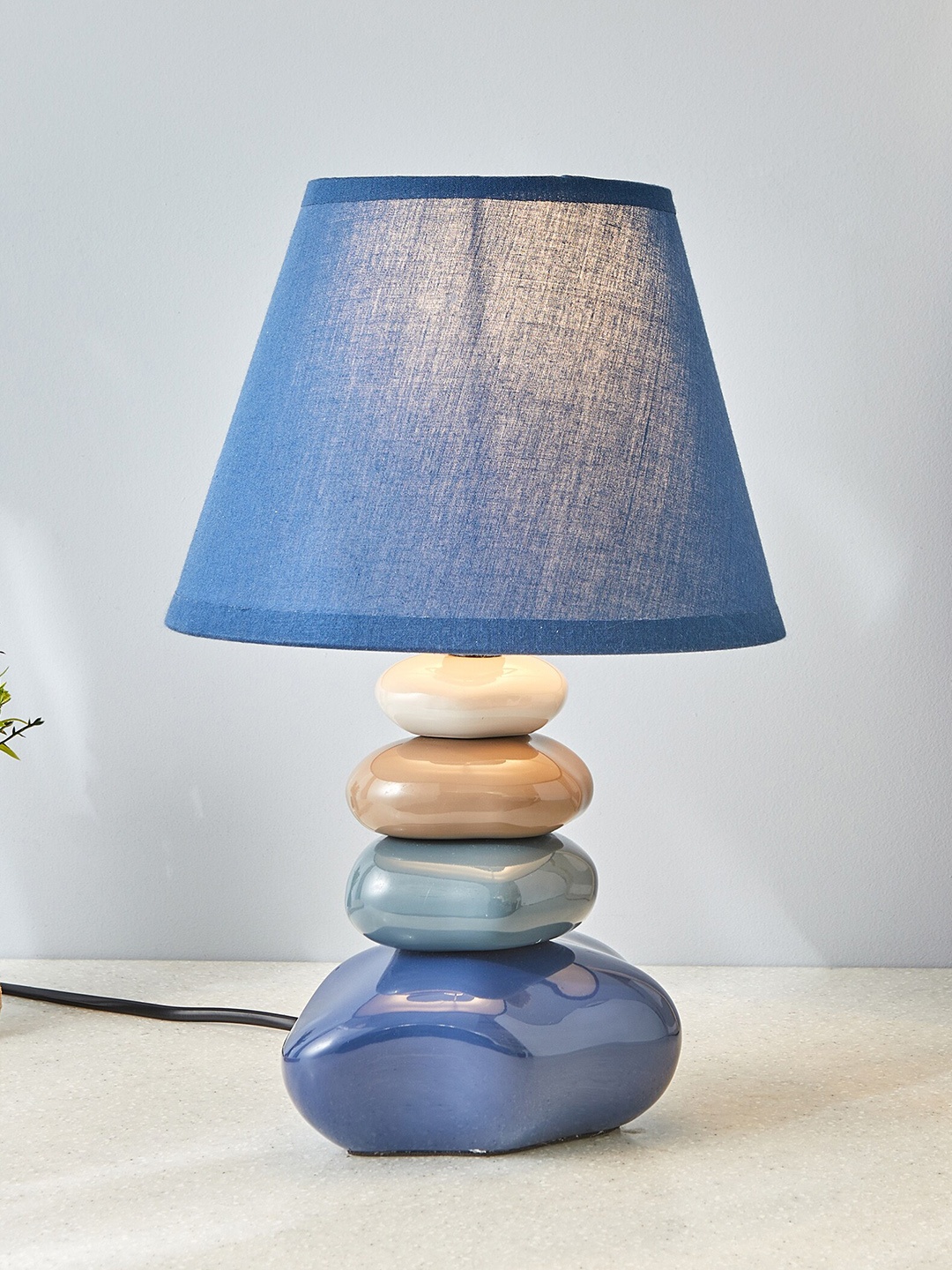 

Home Centre Monolith Marvel Blue Ceramic Pebble Table Lamp