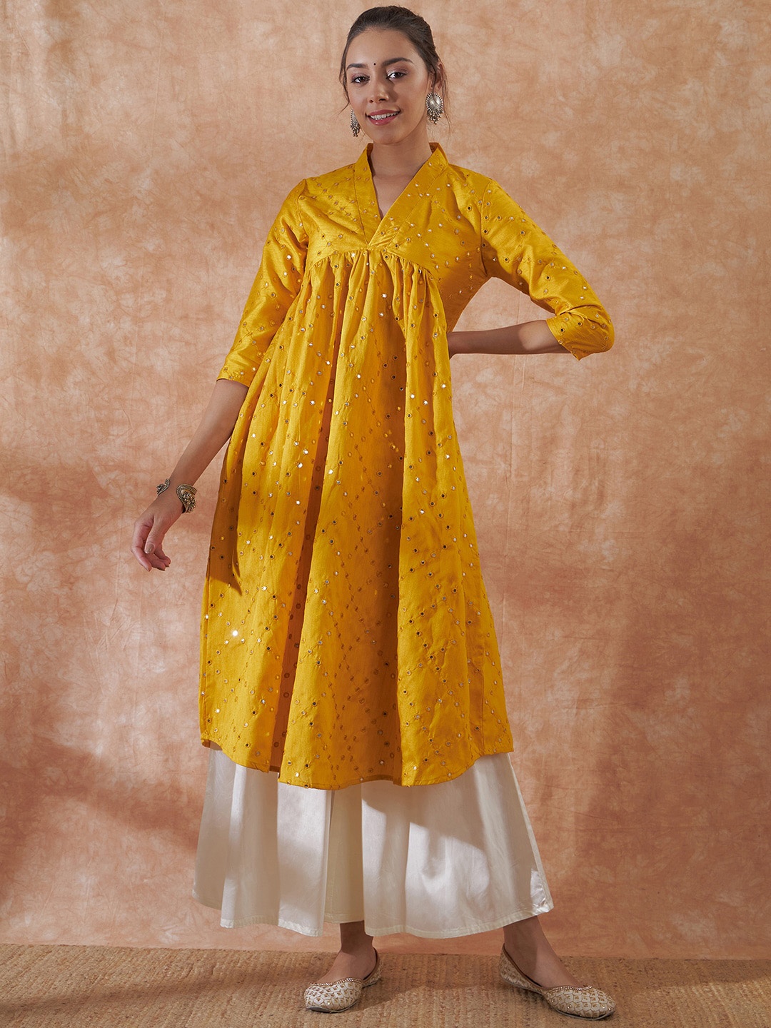 

InWeave Women Mustard Yellow Ethnic Motifs Flared Sleeves Thread Work Kurta