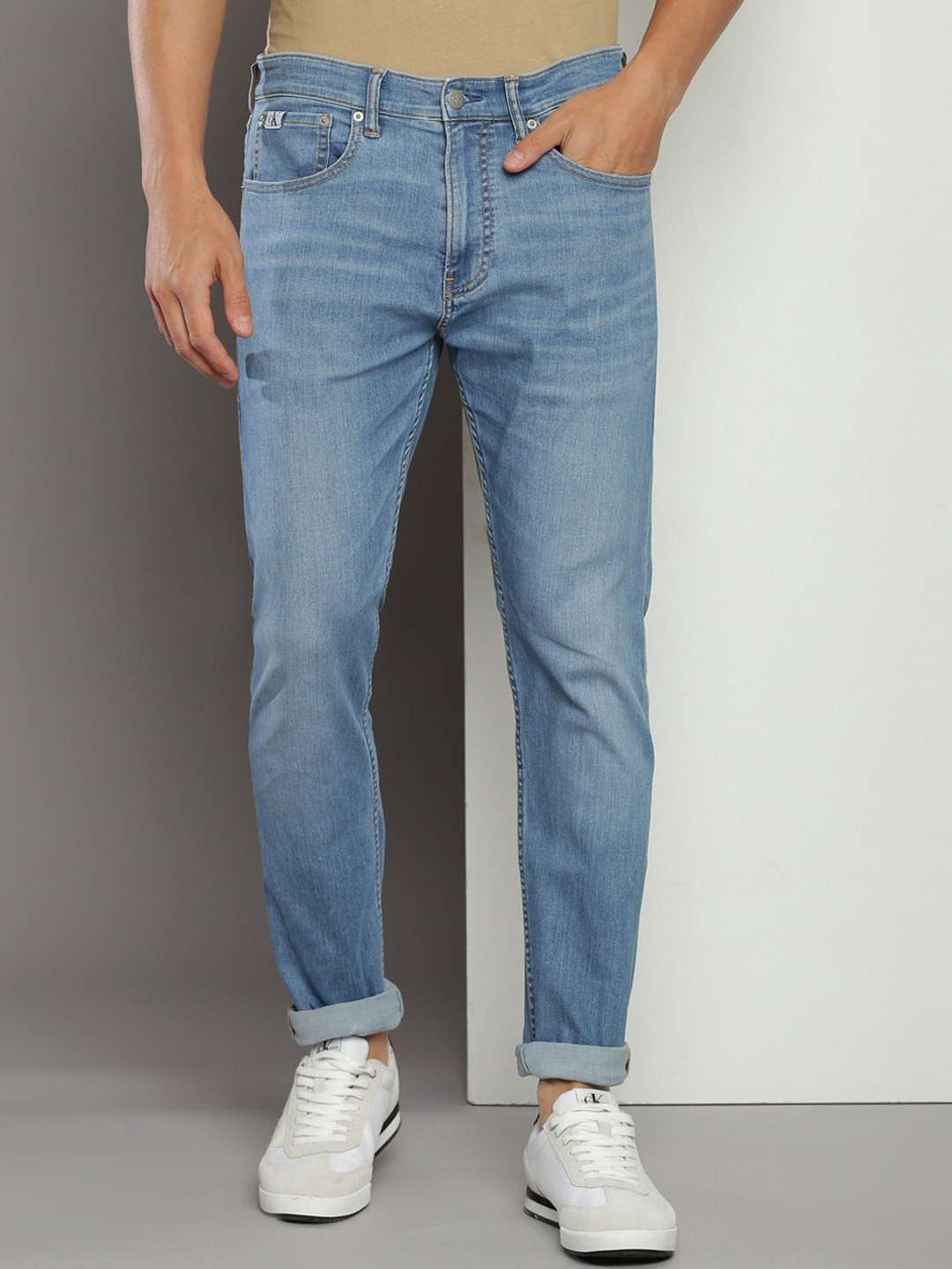 

Calvin Klein Jeans Men Tapered Fit Light Fade Stretchable Whiskers Jeans, Blue