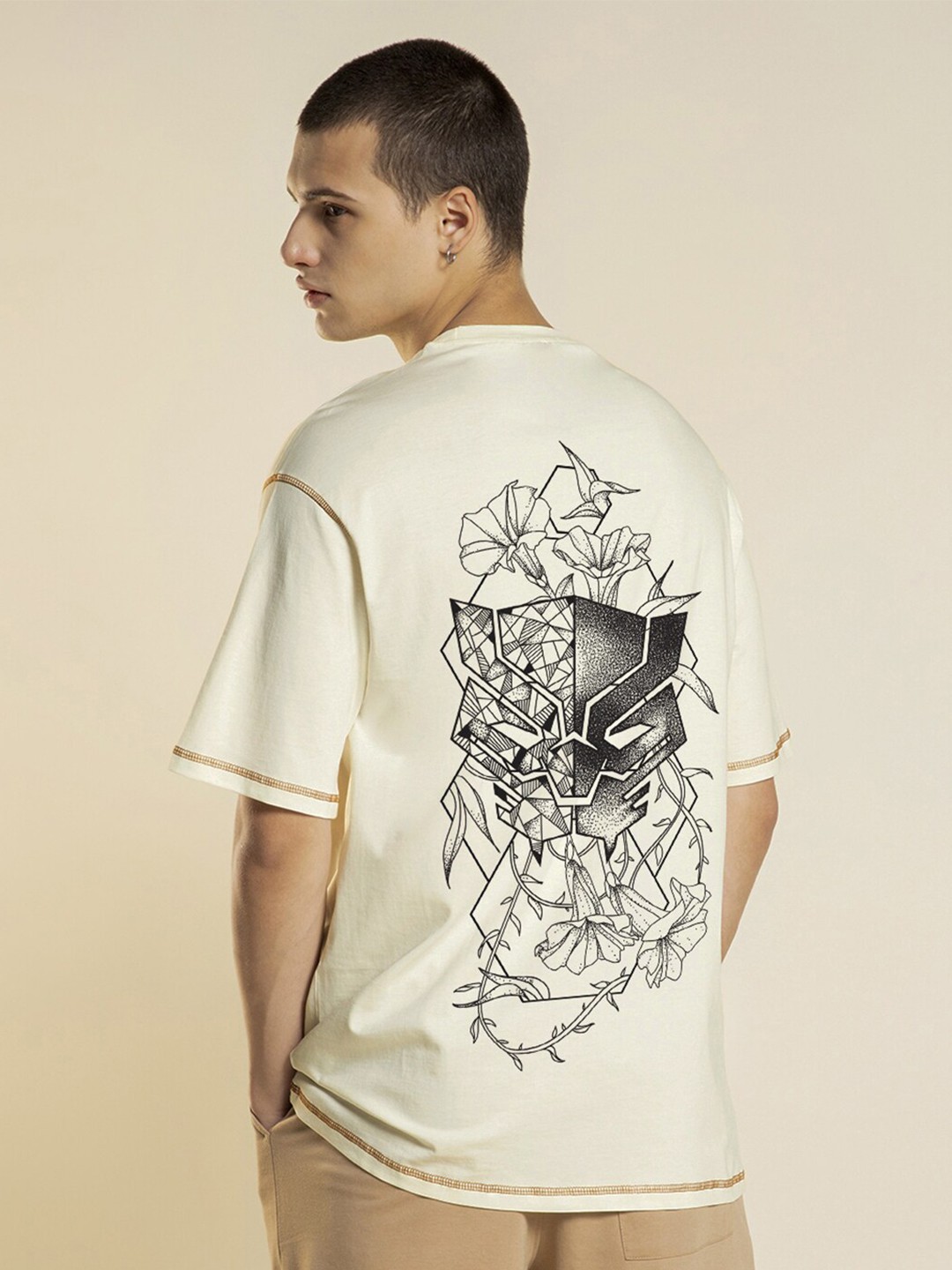 

Bewakoof Official Marvel Merchandise Off Warrior King Graphic Printed Oversized T-shirt, Off white