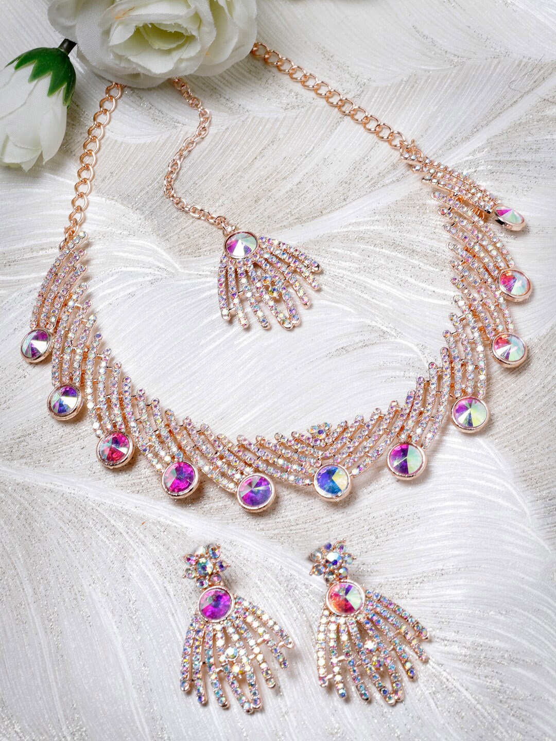 

Sukkhi Rose Gold-Plated Rainbow Stone-Studded Necklace With Earrings And Maang Tika