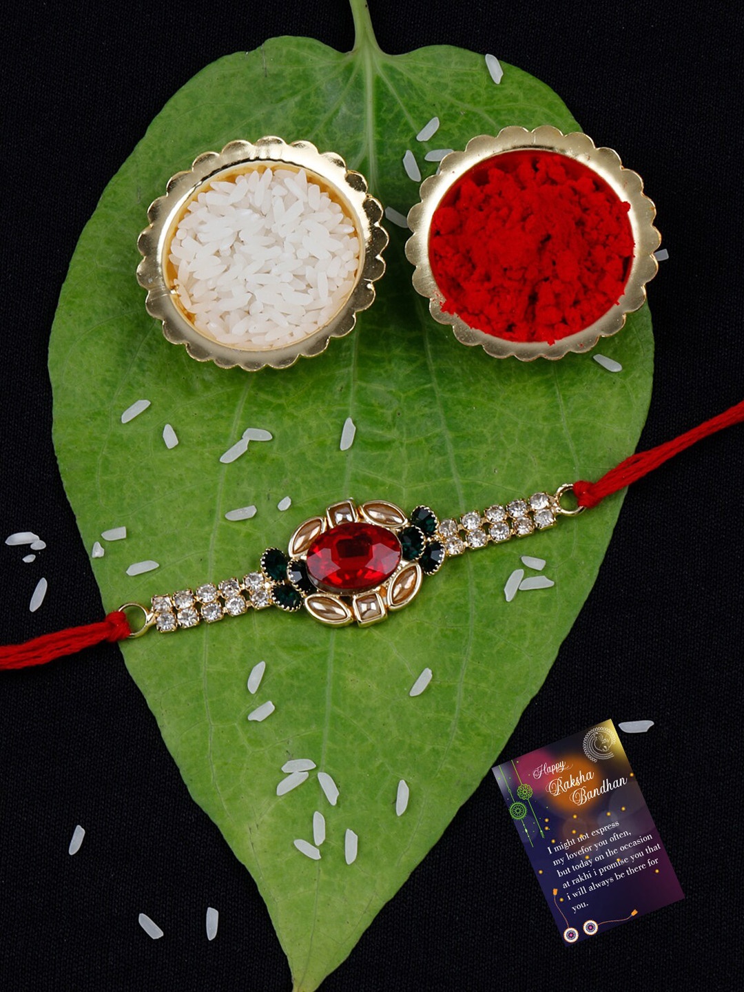 

Silver Shine Set Of 2 Stone Rakhi With Roli Rice & Greeting Card, Red