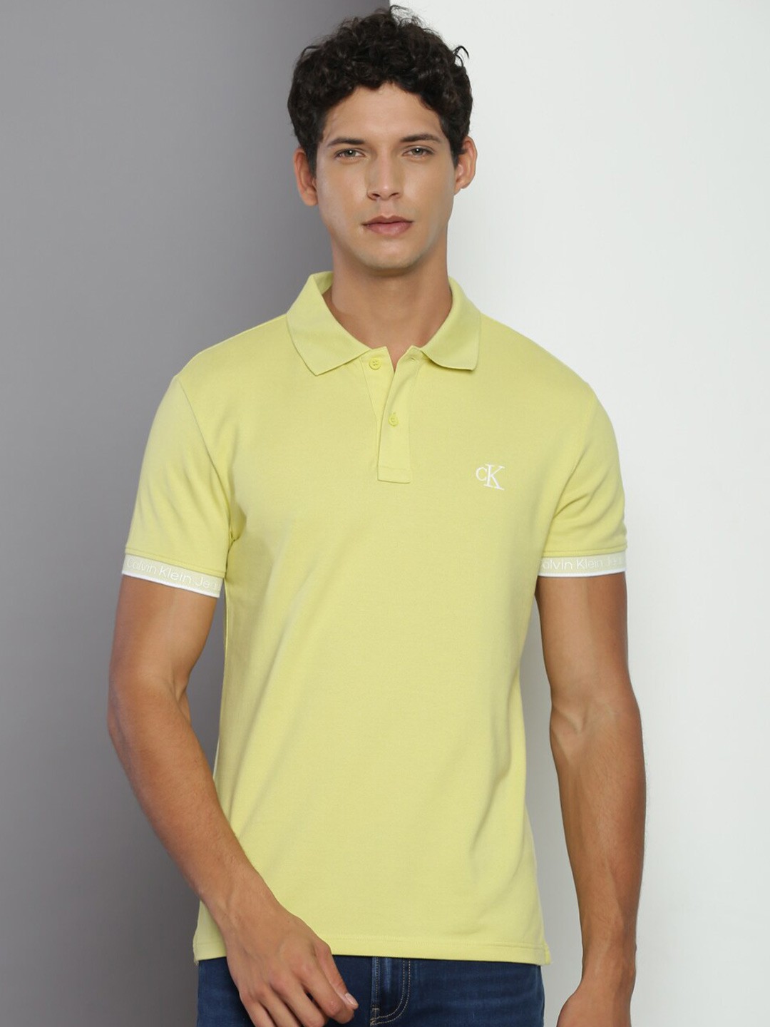 

Calvin Klein Jeans Typography Printed Polo Collar Cotton Regular T-shirt, Yellow