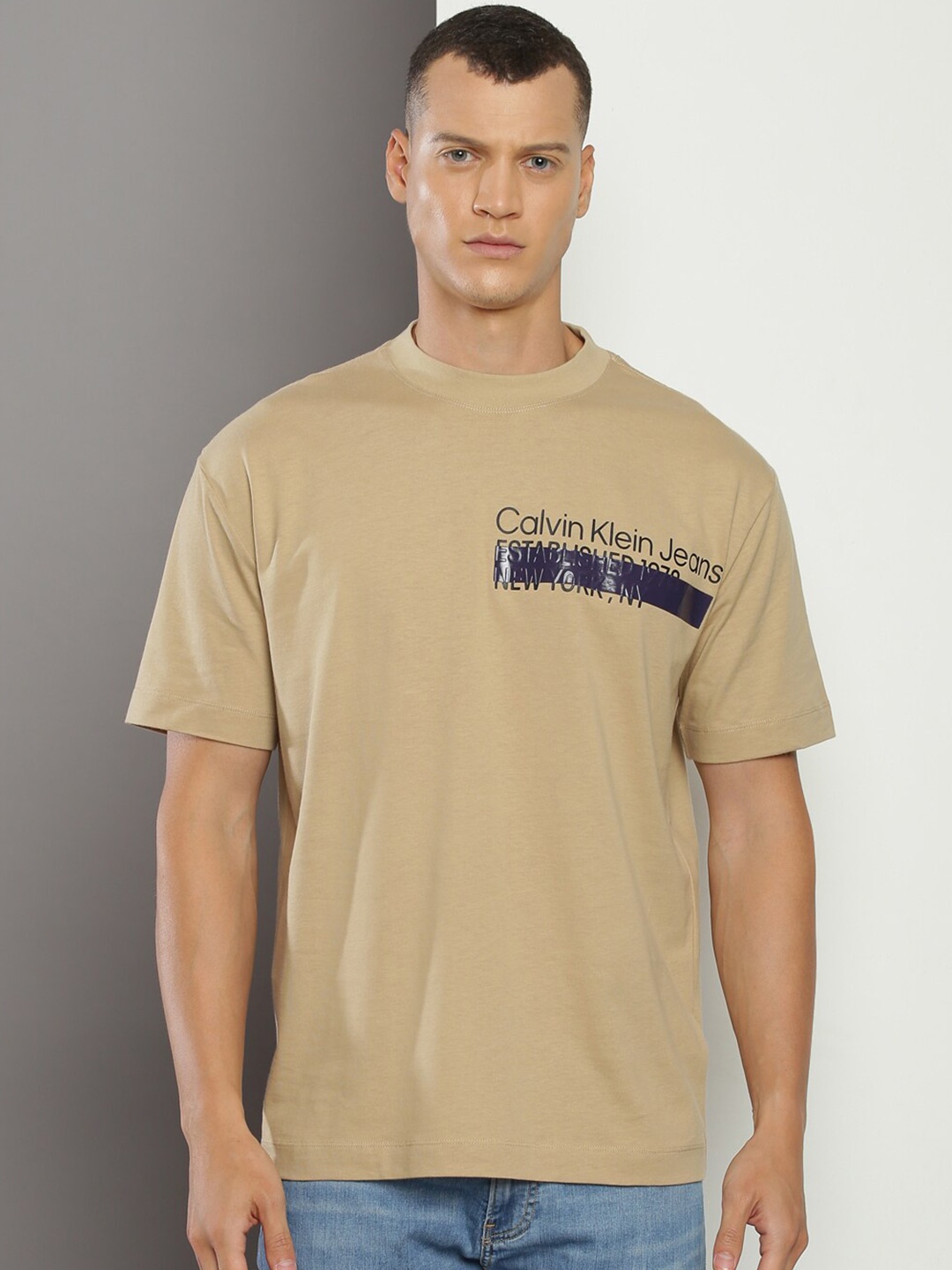 

Calvin Klein Jeans Typography Printed Round Neck Pure Cotton T-shirt, Beige