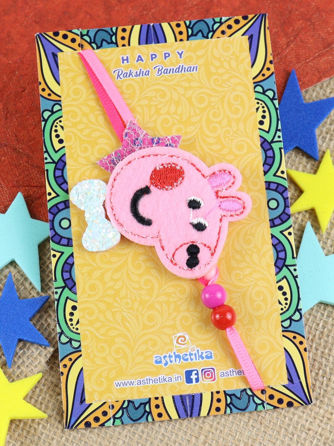 

Asthetika Boys Smiling Pig Thread Rakhi, Pink