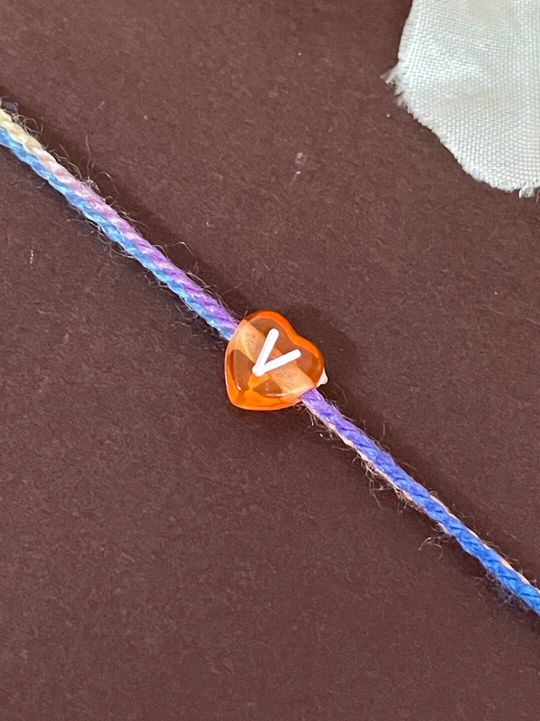 

Digital Dress Room V Alphabet Charm Detail Rakhi, Lavender