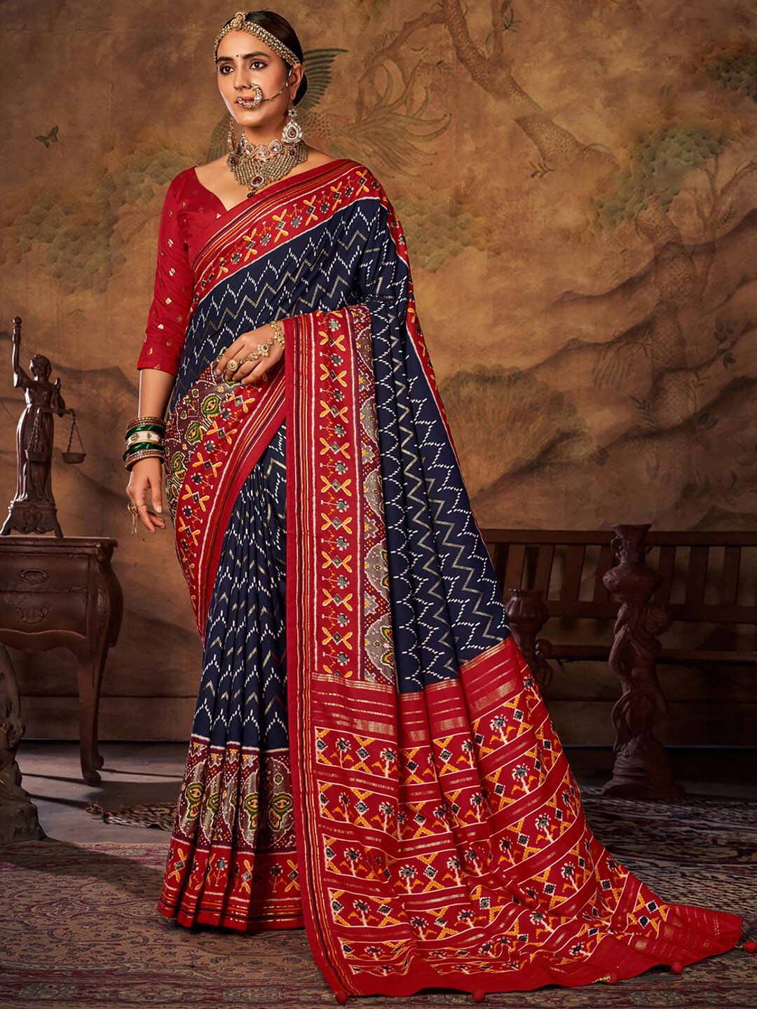 

Saree mall Navy Blue & Red Ethnic Motifs Printed Patola Saree