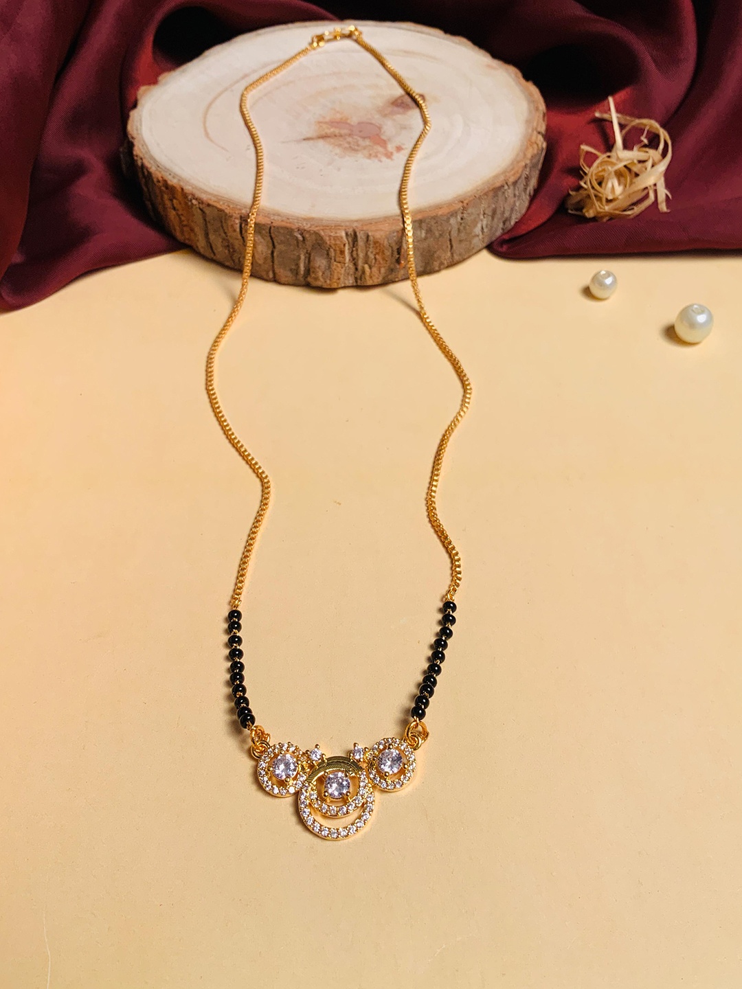 

ABDESIGNS Gold-Plated AD Stone-Studded & Beaded Mangalsutra