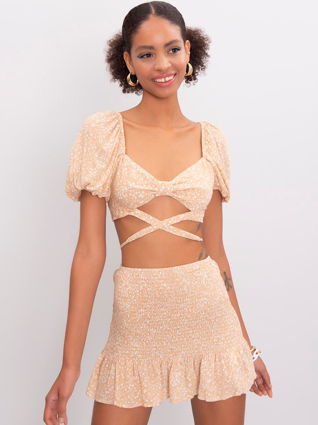 

PRET A TUER Abstract Printed Peplum Mini Skirt, Beige