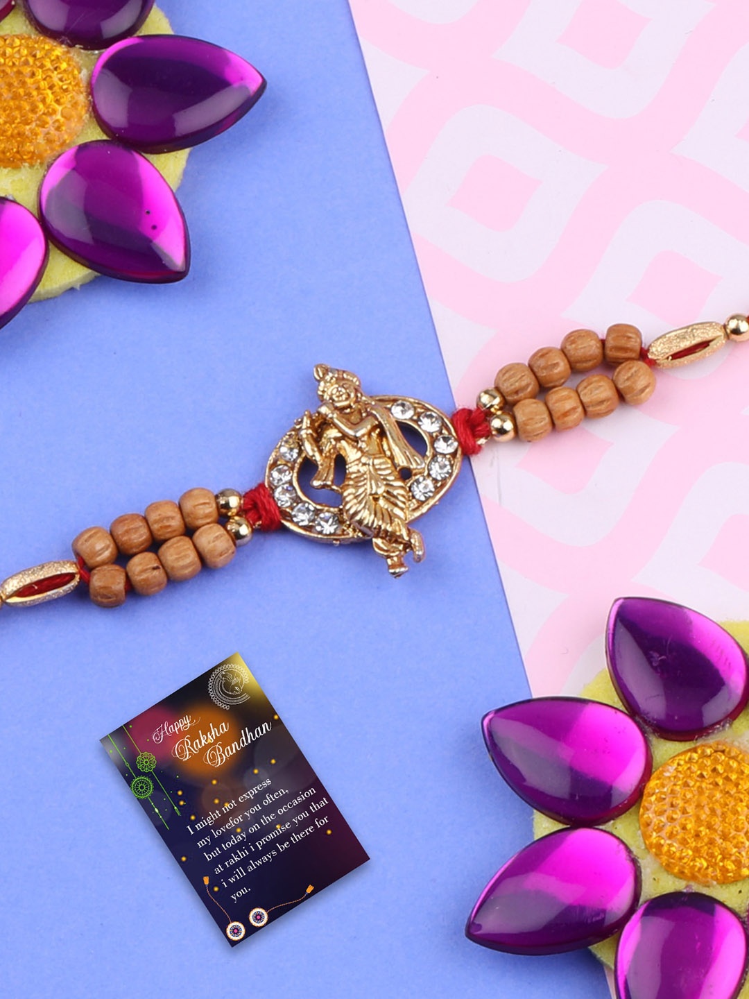 

Silver Shine Set Of 2 Stone Studded & Krishna Rakhis With Roli Chawal & 1 Greeting Card, Red