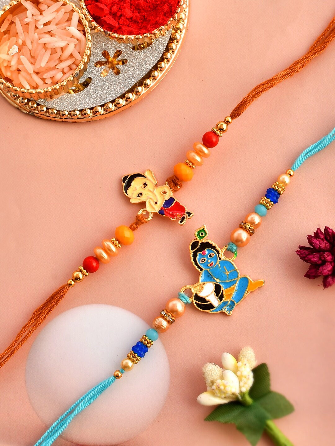 

Aapno Rajasthan Set Of 2 Krishna & Ganesha Charm Rakhis, Red