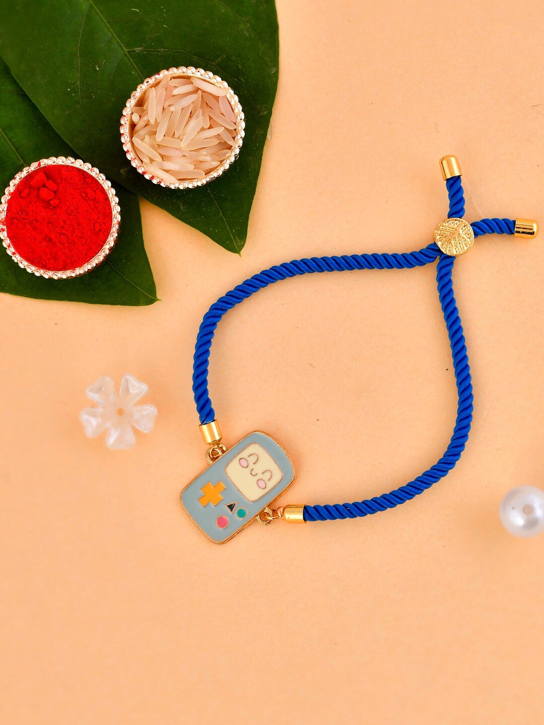 

Aapno Rajasthan Unisex Gameboy Console Bracelet Rakhi With Roli Chawal & Greeting Card, Blue