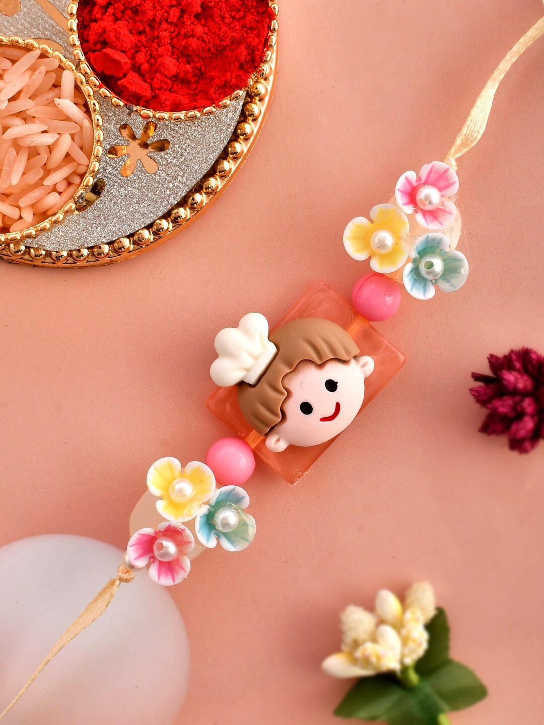 

Aapno Rajasthan Flower and Pearls Crafted 3D Chef Kids Rakhi, Pink