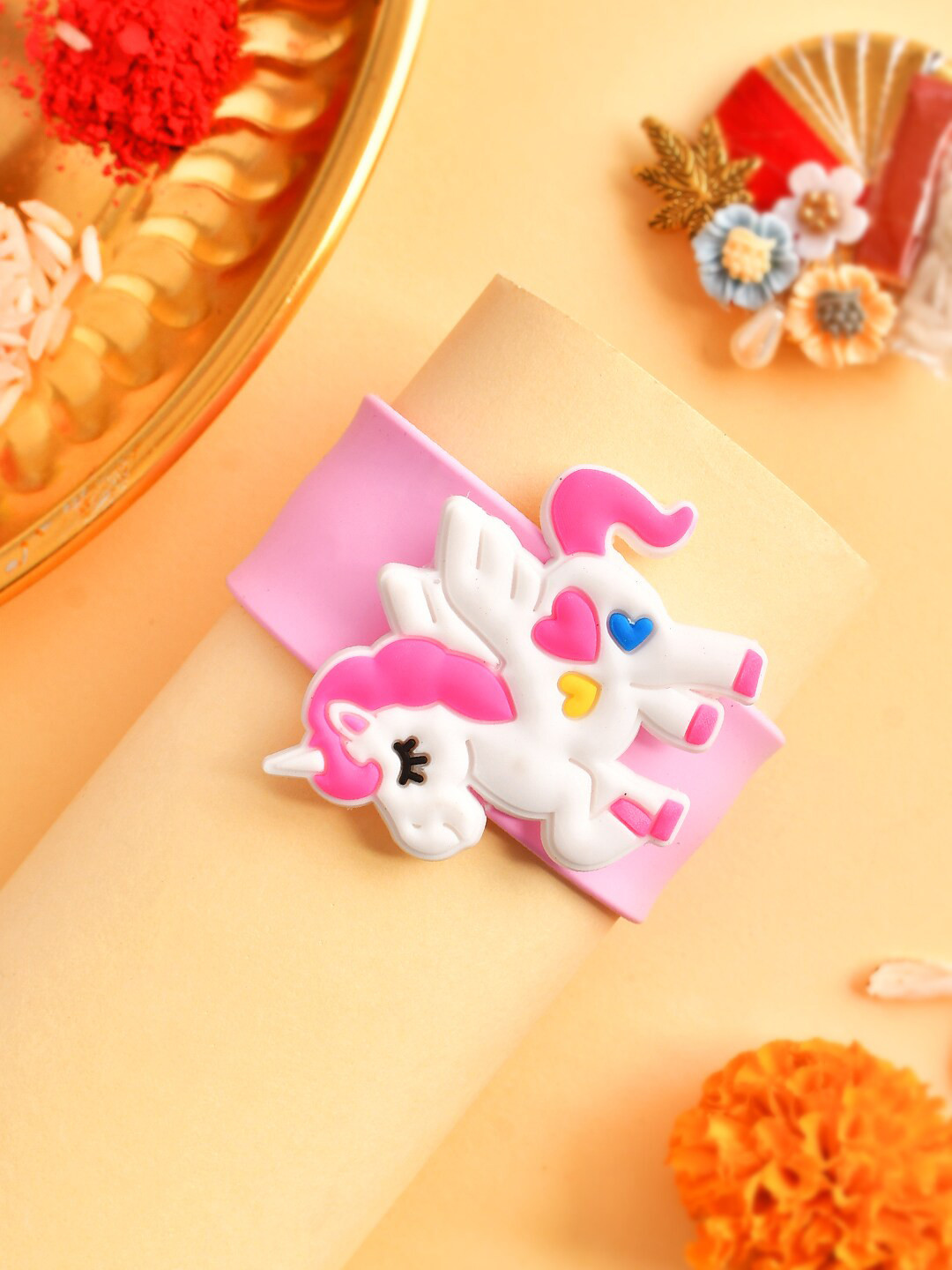 

Aapno Rajasthan Kids Unicorn Charm Wrist Band Rakhi With Roli Chawal & Greeting Card, Pink