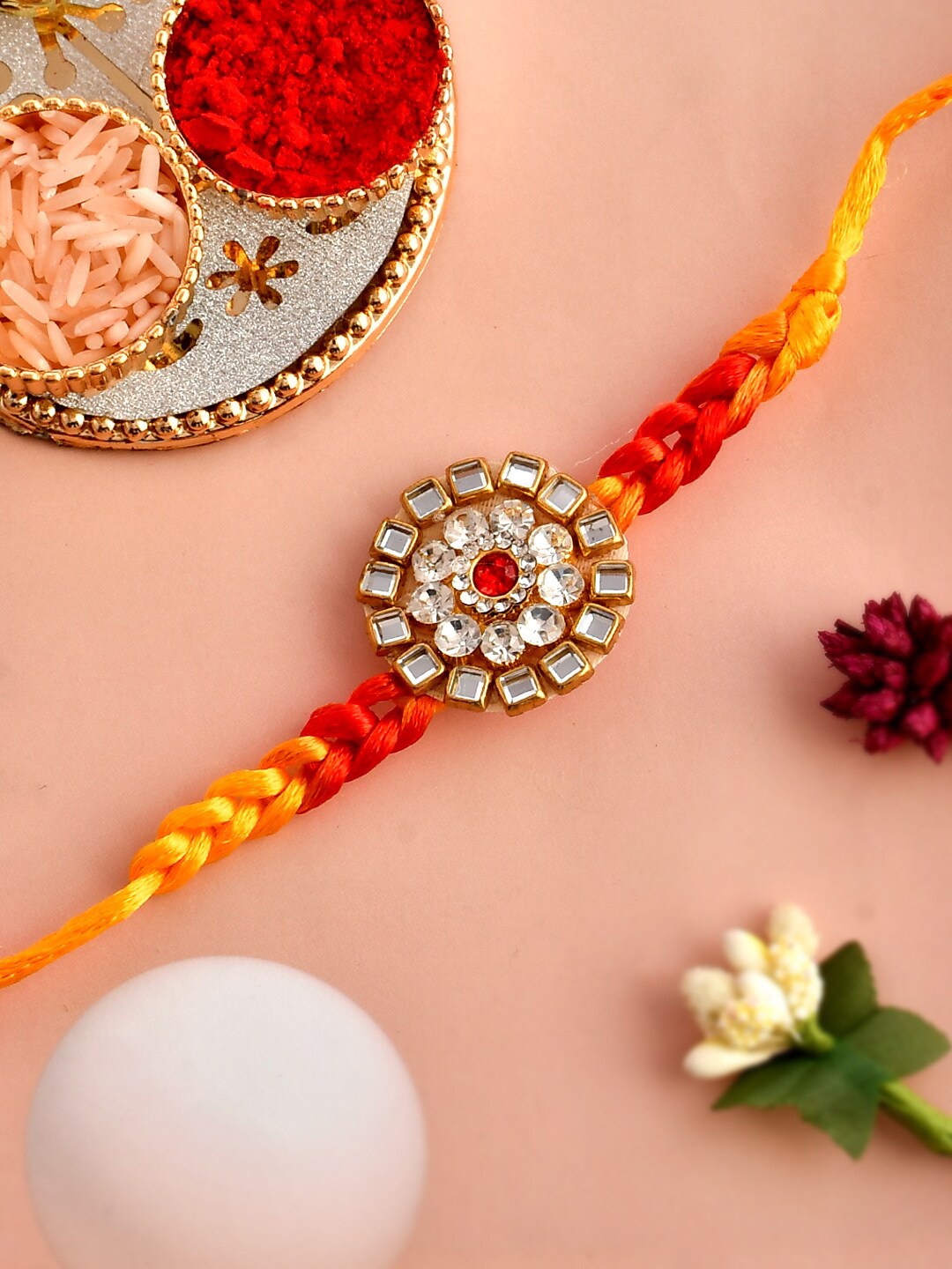 

Aapno Rajasthan Unisex Stone-Studded Flower Charm Beaded Rakhi With Roli Chawal & Card, Red