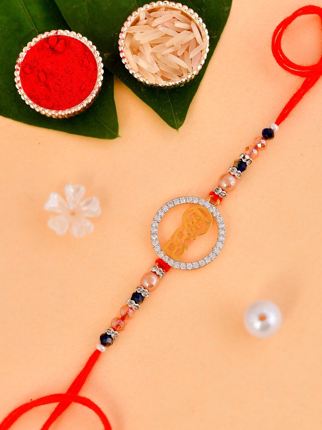

Aapno Rajasthan Bro Charm-Studded Thread Rakhi With Roli Chawal & Greeting Card, Red