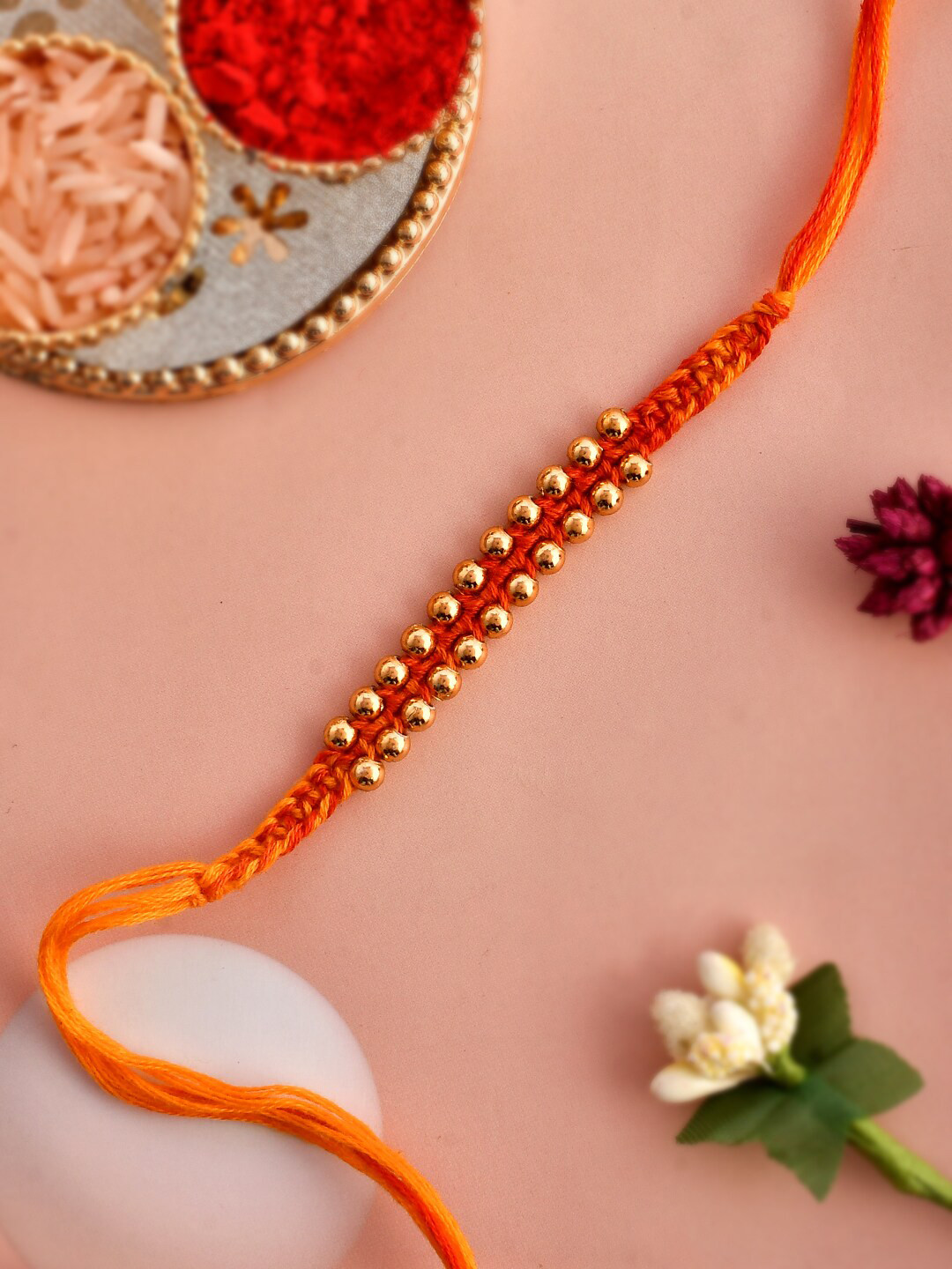 

Aapno Rajasthan Ghungroo Bhaiya Rakhi With Roli Rice & Greeting Card, Orange