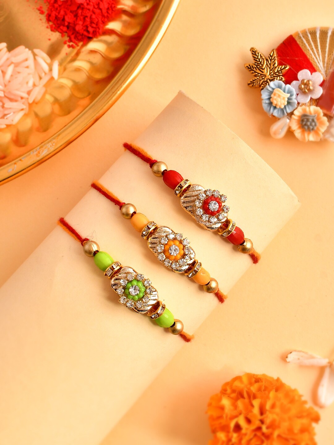 

Aapno Rajasthan Set Of 3 Beaded Detail Rakhis, Gold