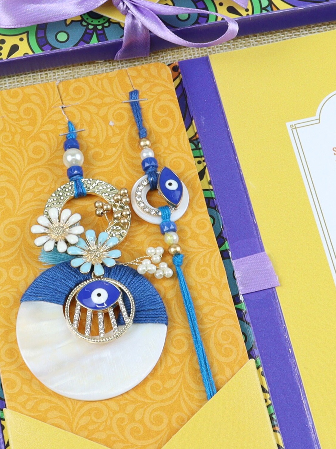 

Asthetika Unisex Set of 2 Stone-Studded Flower Charm Beaded Rakhis With Envelope, Blue