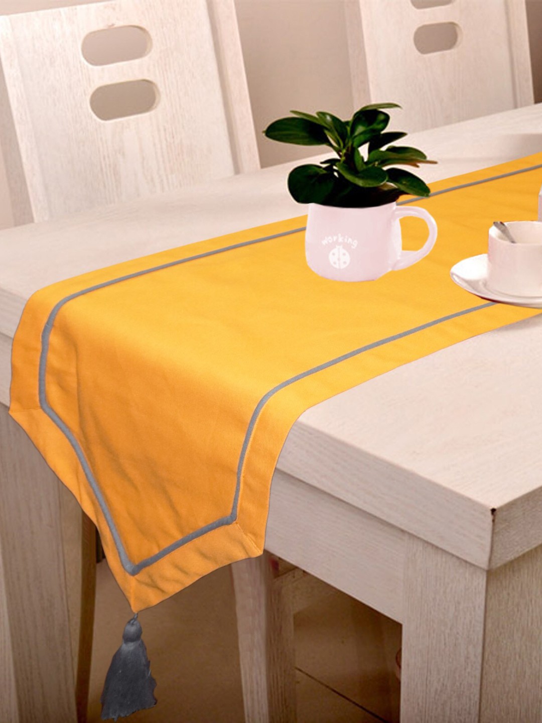 

Lushomes Orange Colored Pure Cotton 6 Seater Table Runner