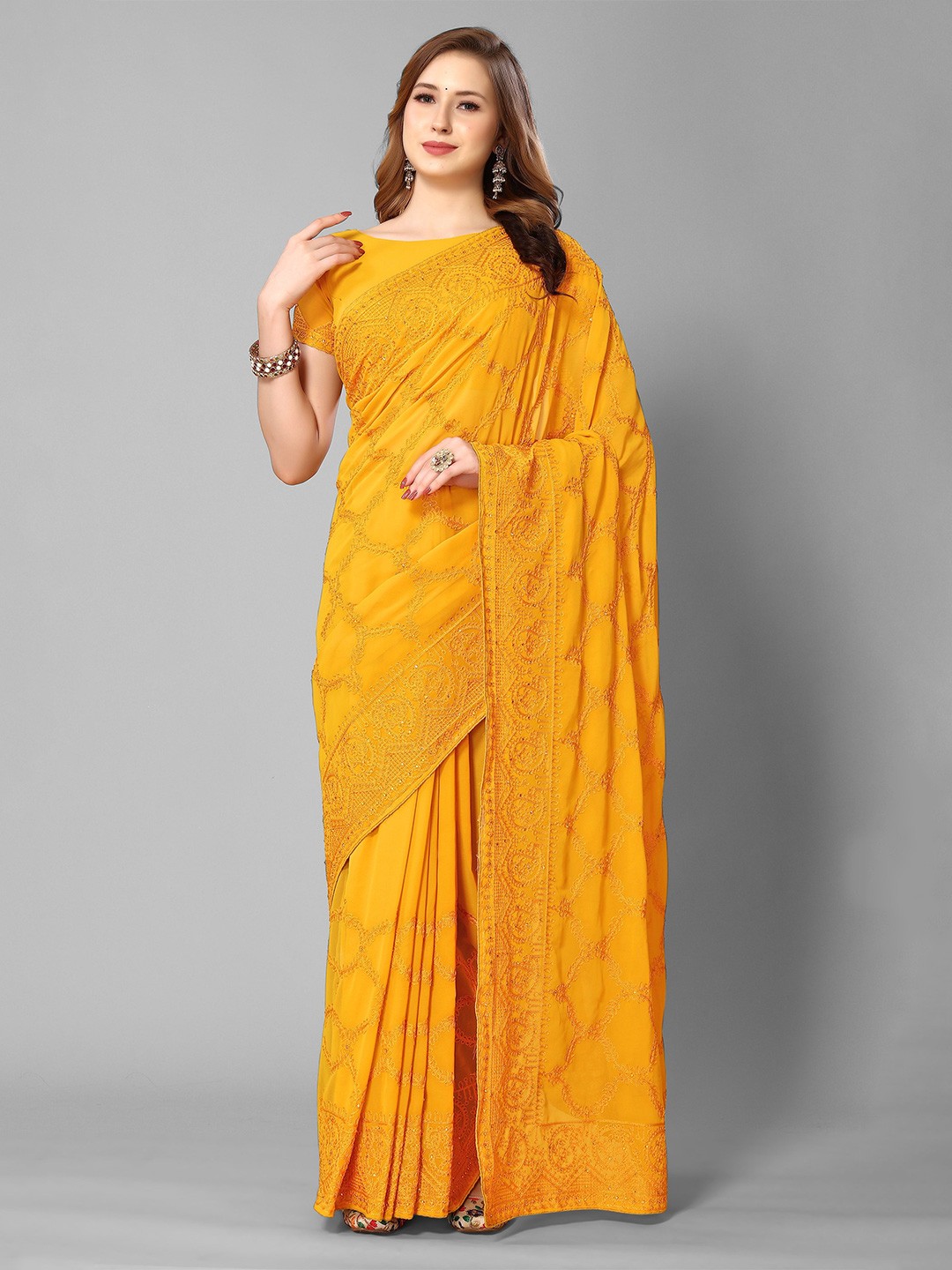 

Mitera Ethnic Motifs Embroidered Pure Georgette Saree, Mustard
