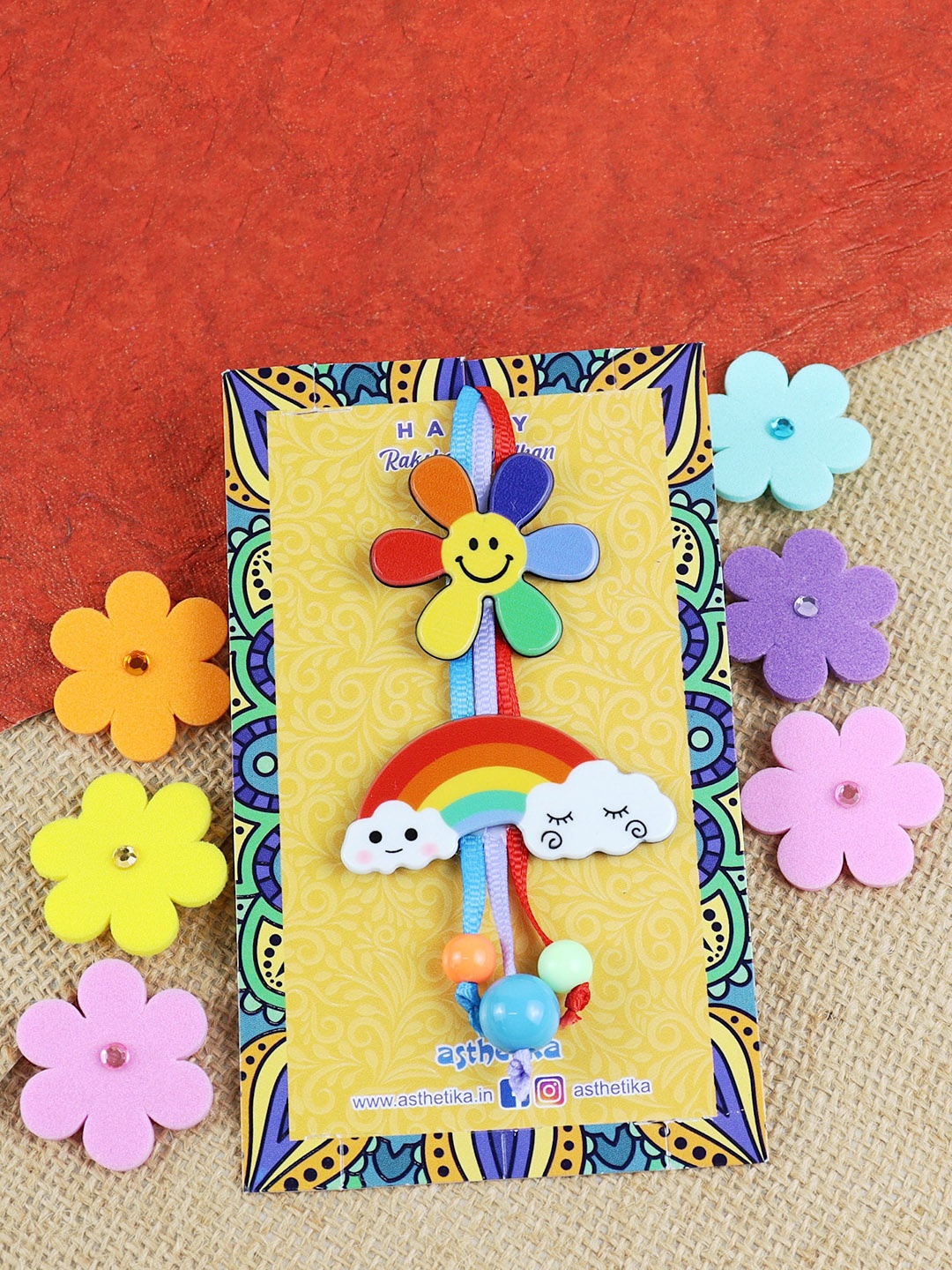 

Asthetika Girls Smiling Flower Rainbow Lumba Rakhi, Pink