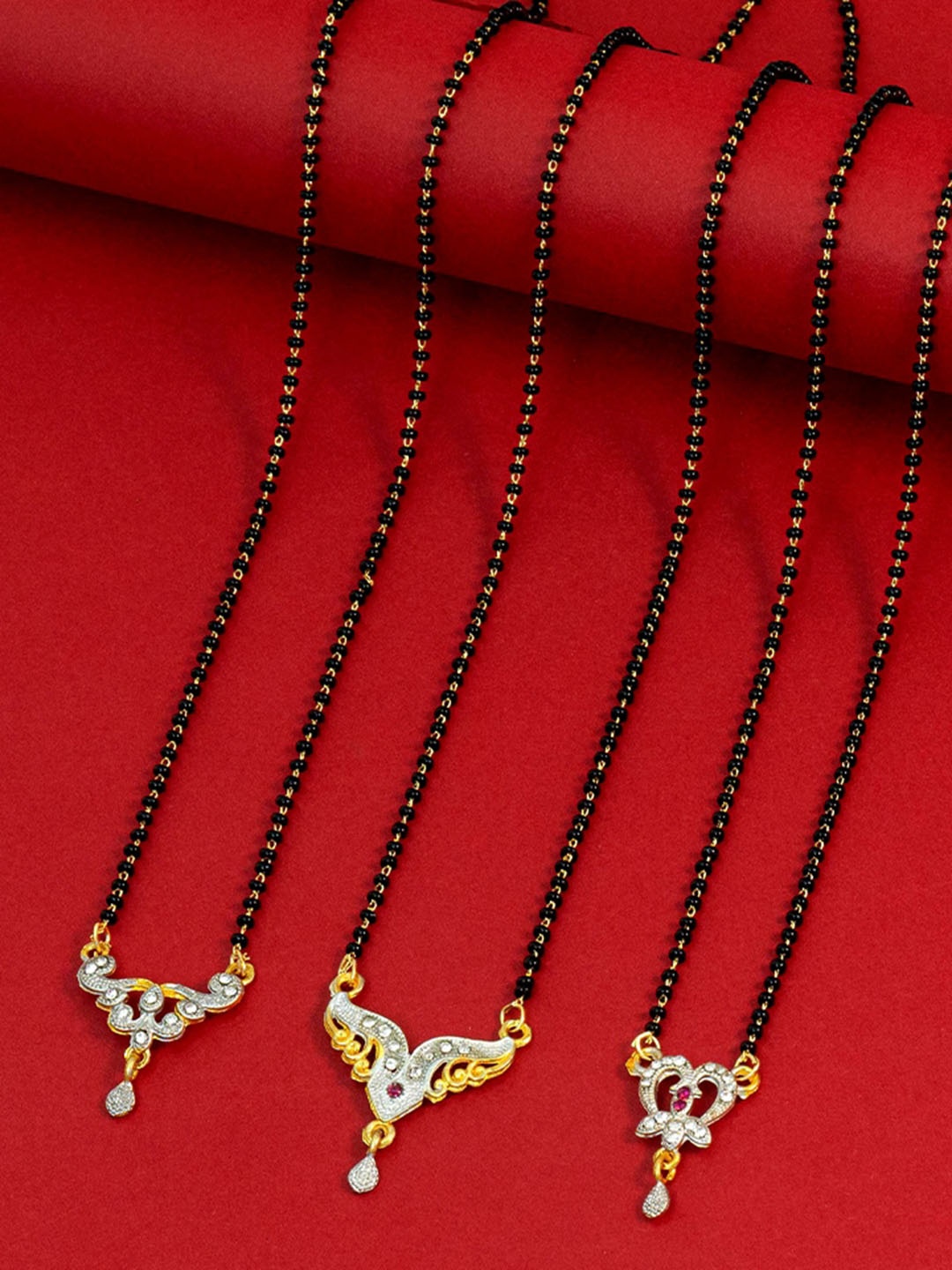 

Ramdev Art Fashion Jwellery Set Of 3 Gold-Plated Stone-Studded & Beaded Mangalsutra