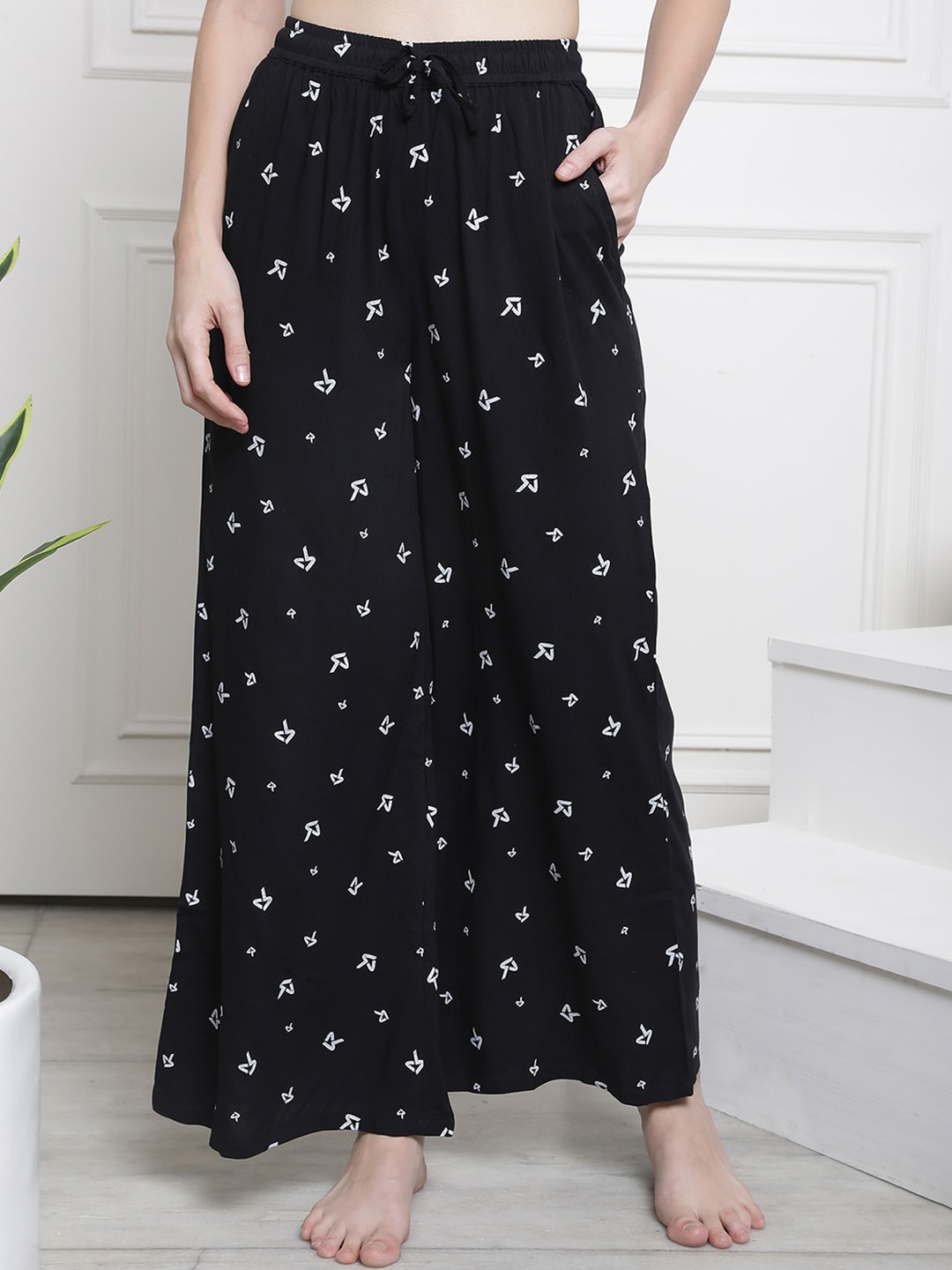 

Claura Women Mid-Rise Cotton Printed Flared Lounge Pants, Black