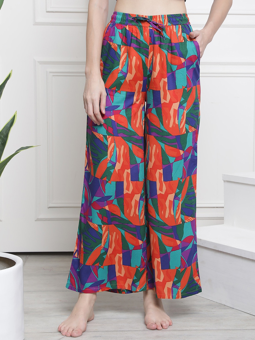 

Claura Women Blue & Orange Abstract Printed Flared Cotton Lounge Pants