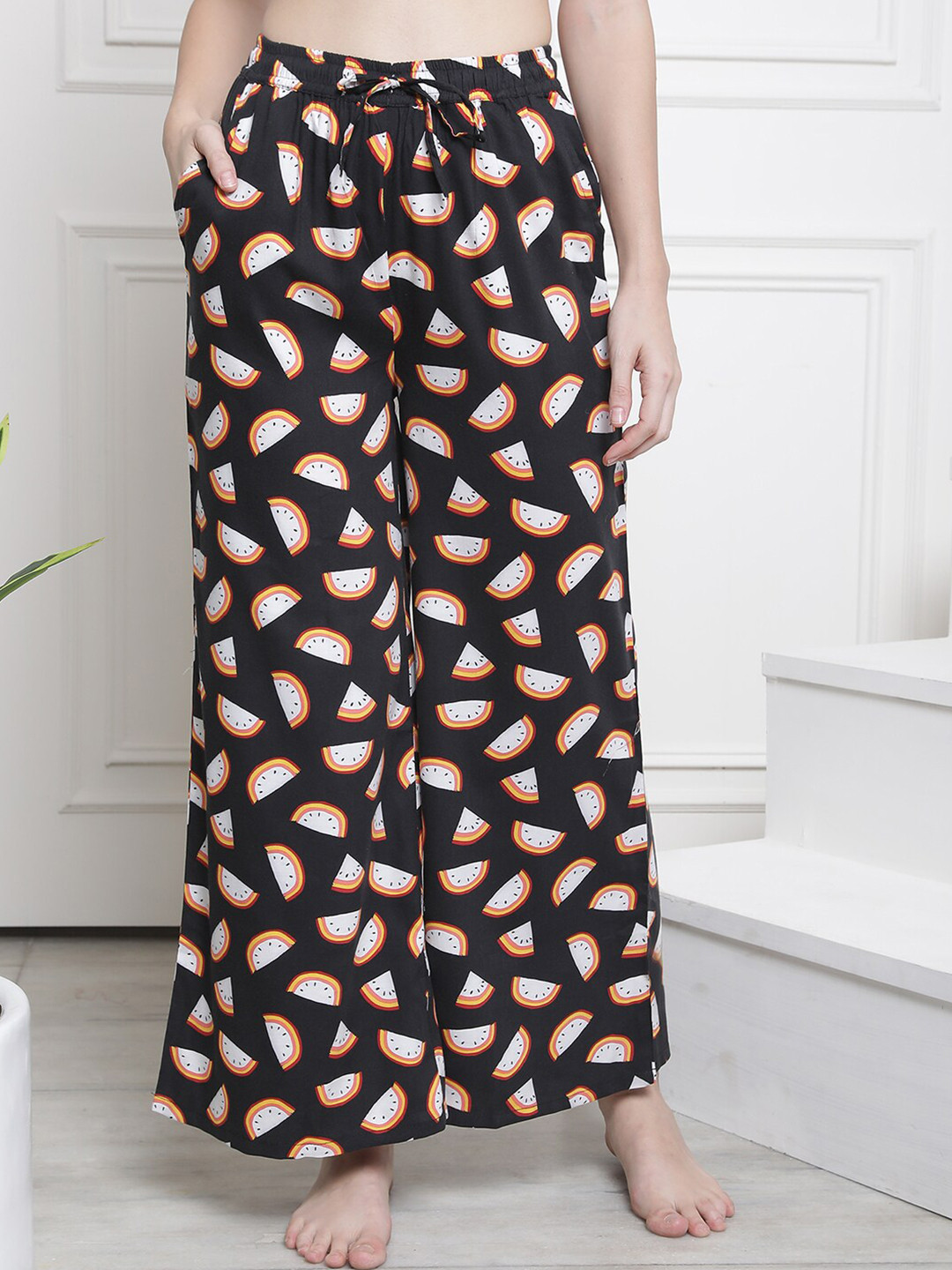 

Claura Women Black Printed Flared Lounge Pants