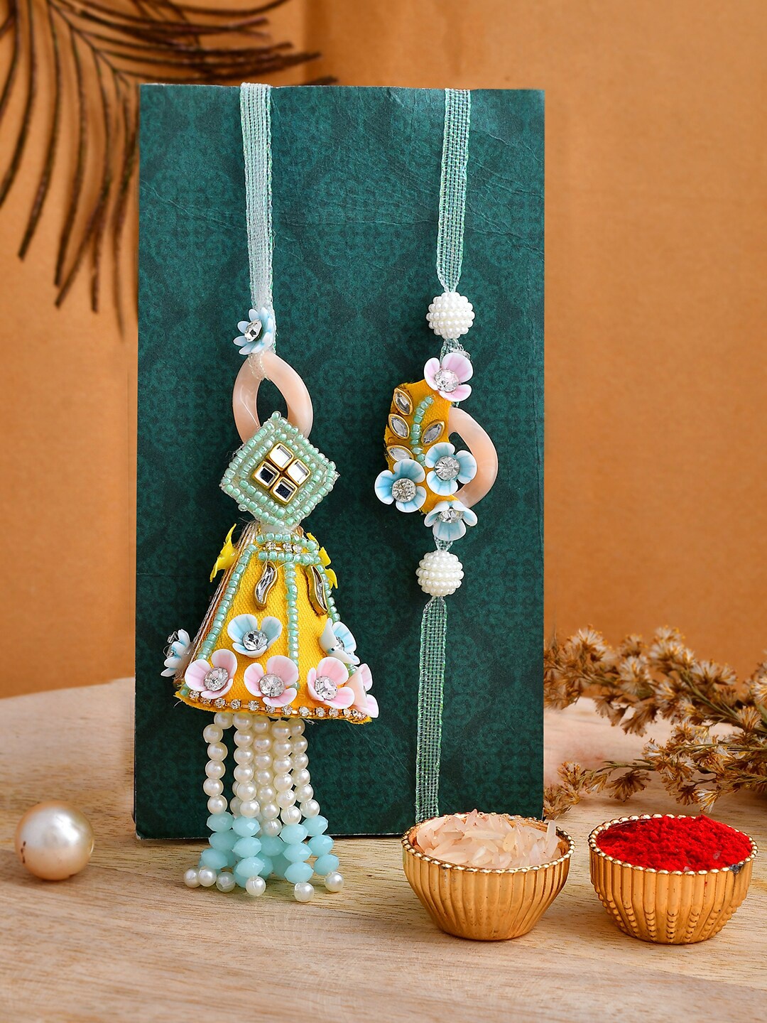 

Shoshaa Kundan Yellow & Blue Bhai Bhabhi Lumba Rakhi with Roli Chawal