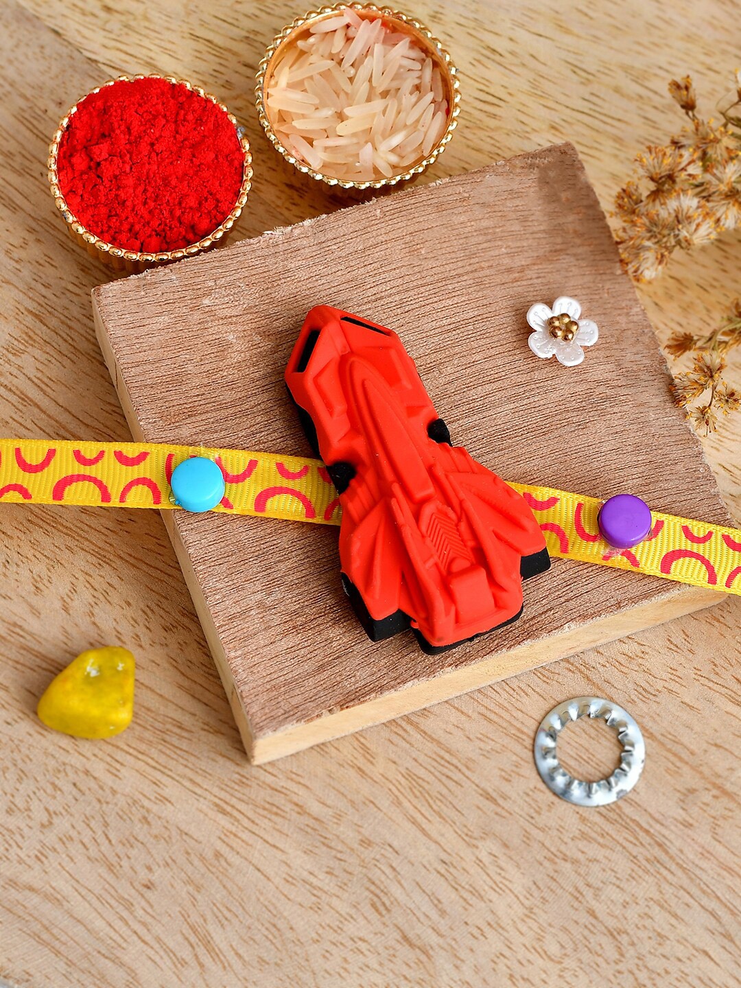 

Shoshaa Red & Yellow Jet Plane Kids Eraser Rakhi with Roli Chawal