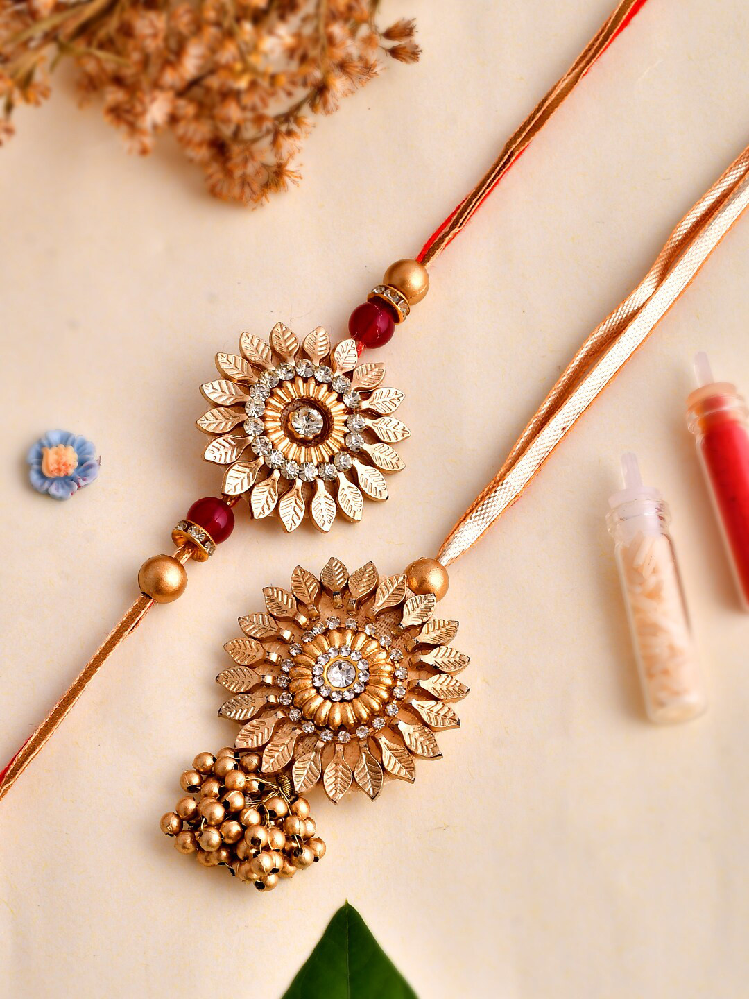 

Shoshaa Floral Shape Stones Brown & Red Lumba Bhai Bhabhi Rakhi with Roli Chawal, Gold