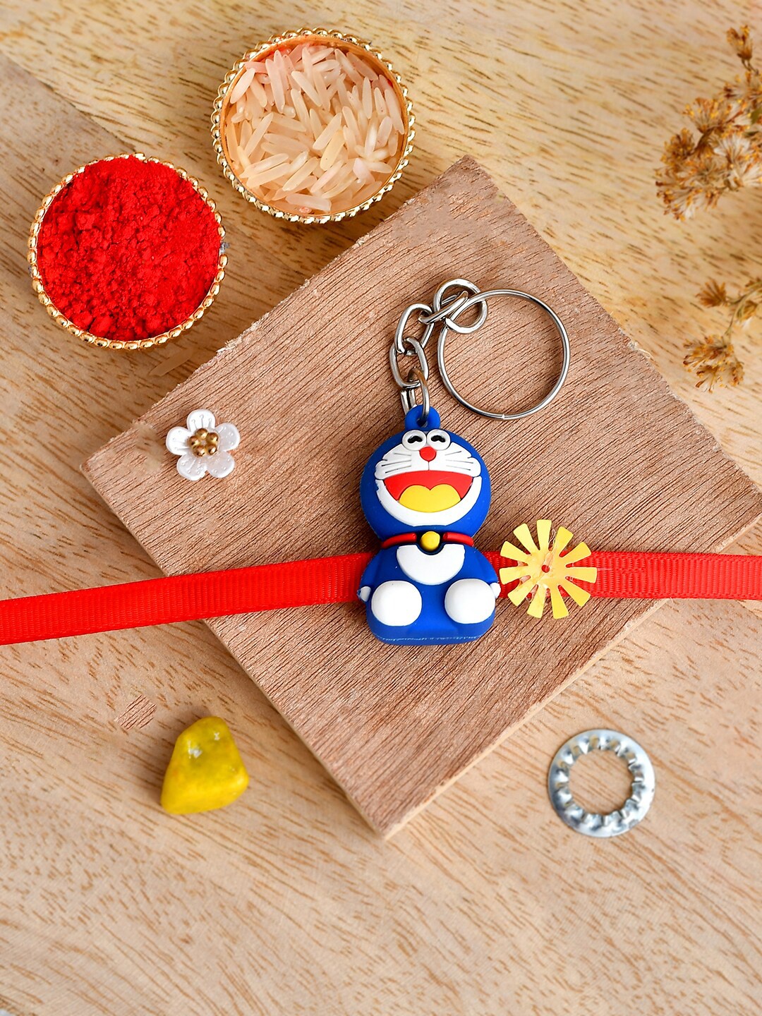 

Shoshaa Blue & Red Doraemon Kids Rakhi Key Chain with Roli Chawal