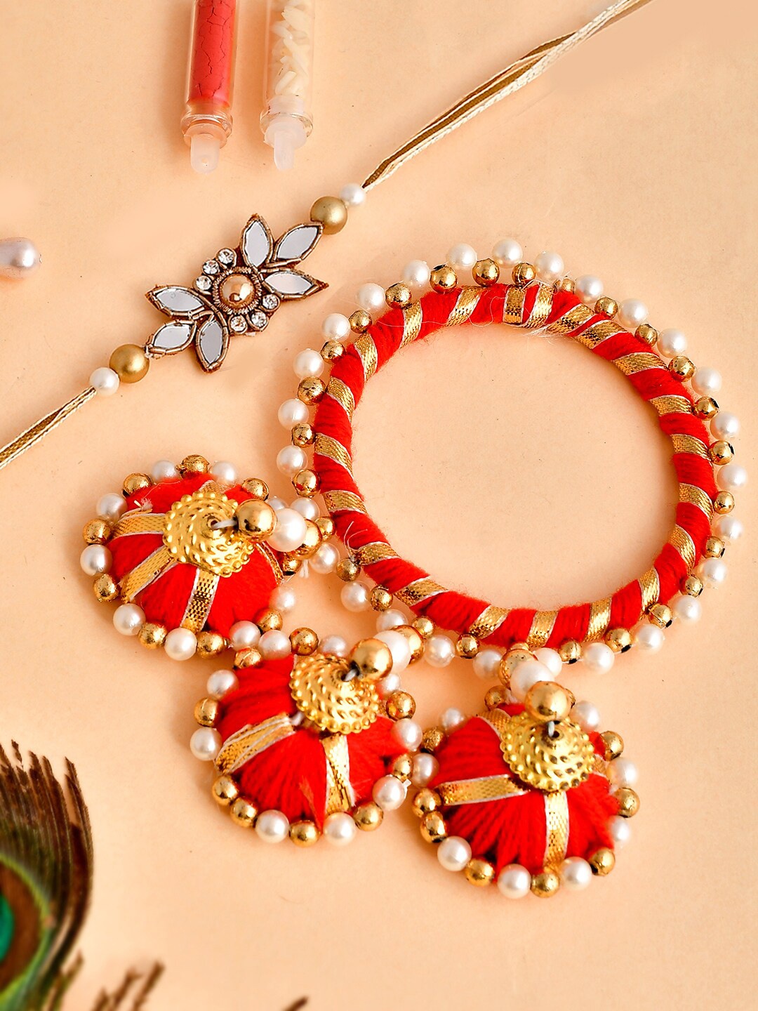 

Shoshaa Gold Mirror Sttone Bhai Rakhi & Red Beaded Lumba Bangle Bhai Bhabhi Rakhi