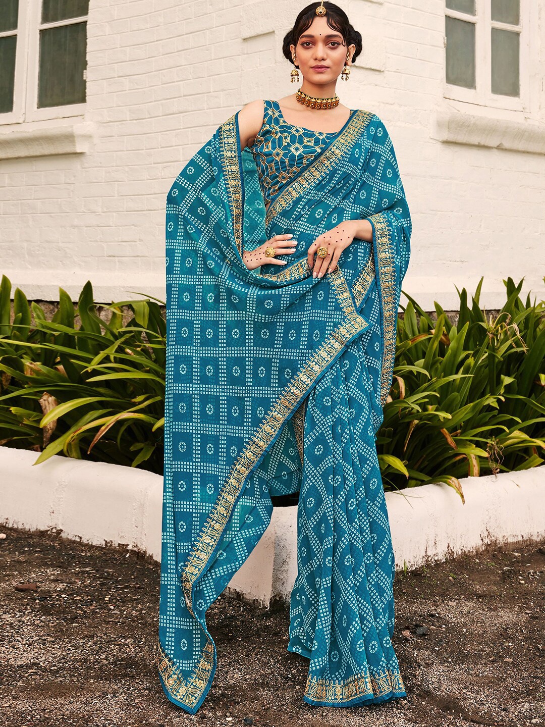 

Mitera Teal Blue & White Bandhani Printed Embroidered Saree