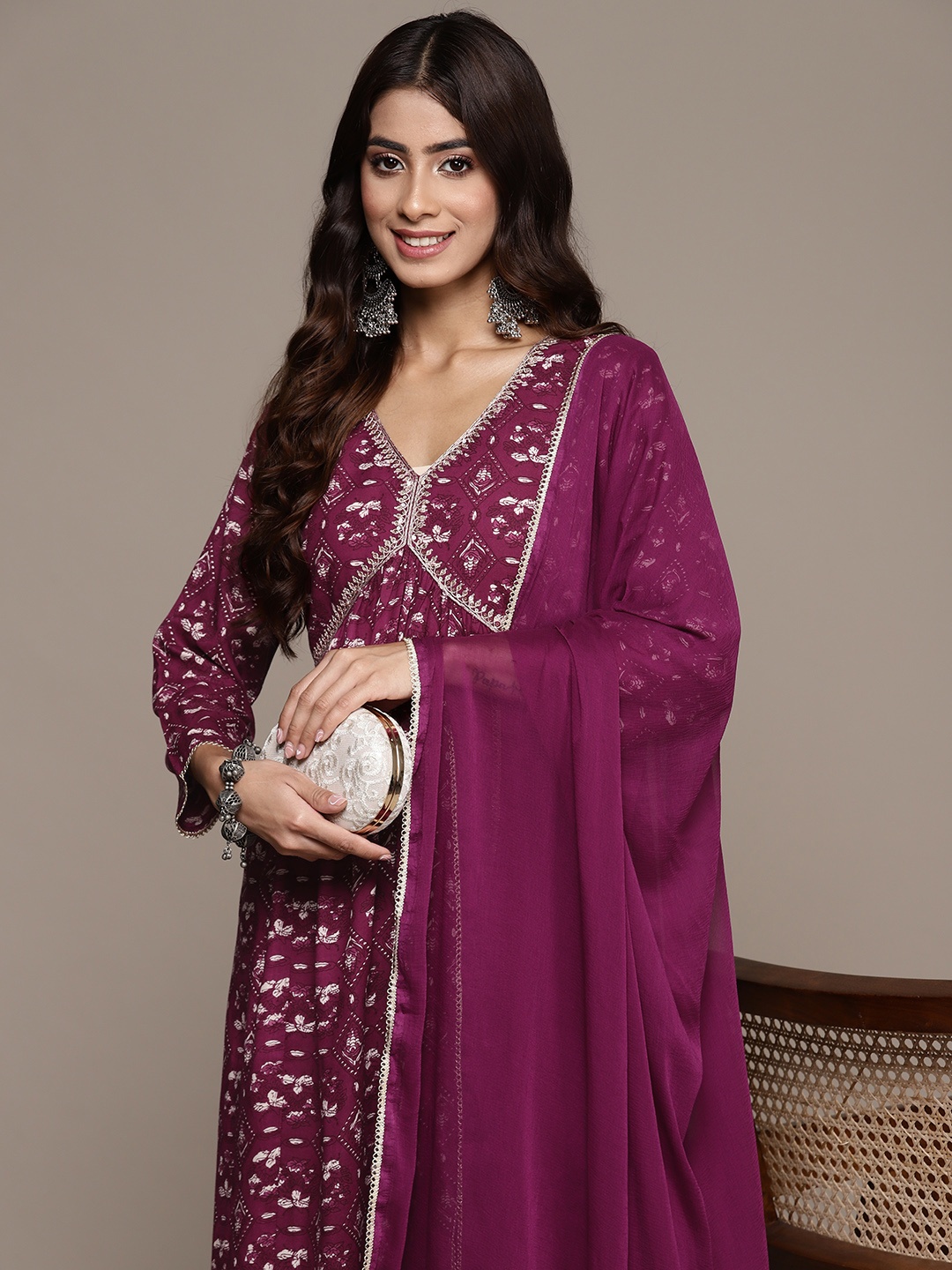 

Ishin Women Ethnic Motifs Printed Regular Thread Work Kurta with Trousers & With Dupatta, Mauve